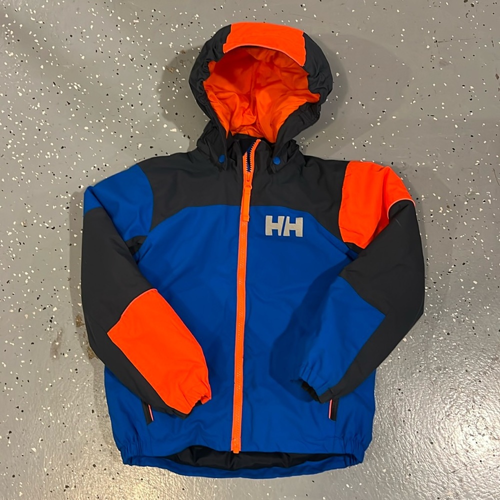 HH waterproof jacket with gloves for skiing, snowboarding or sailing.